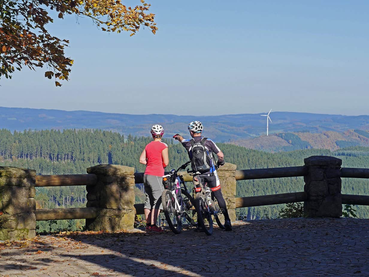 Mountain Biker helping another rider