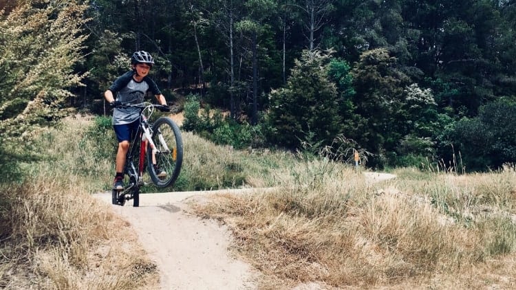 kid jumping on mountain bike