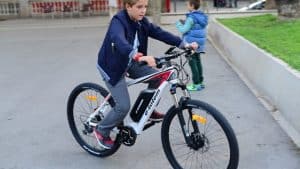 kid riding electric mountain bike