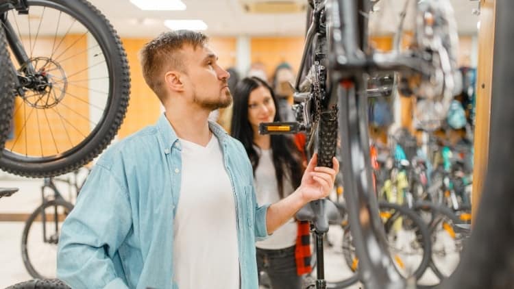 man shopping for a bike at a store