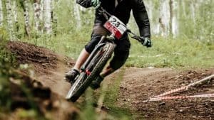 mountain biker cornering hard on mountain bike