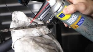 rider degreasing bike chain