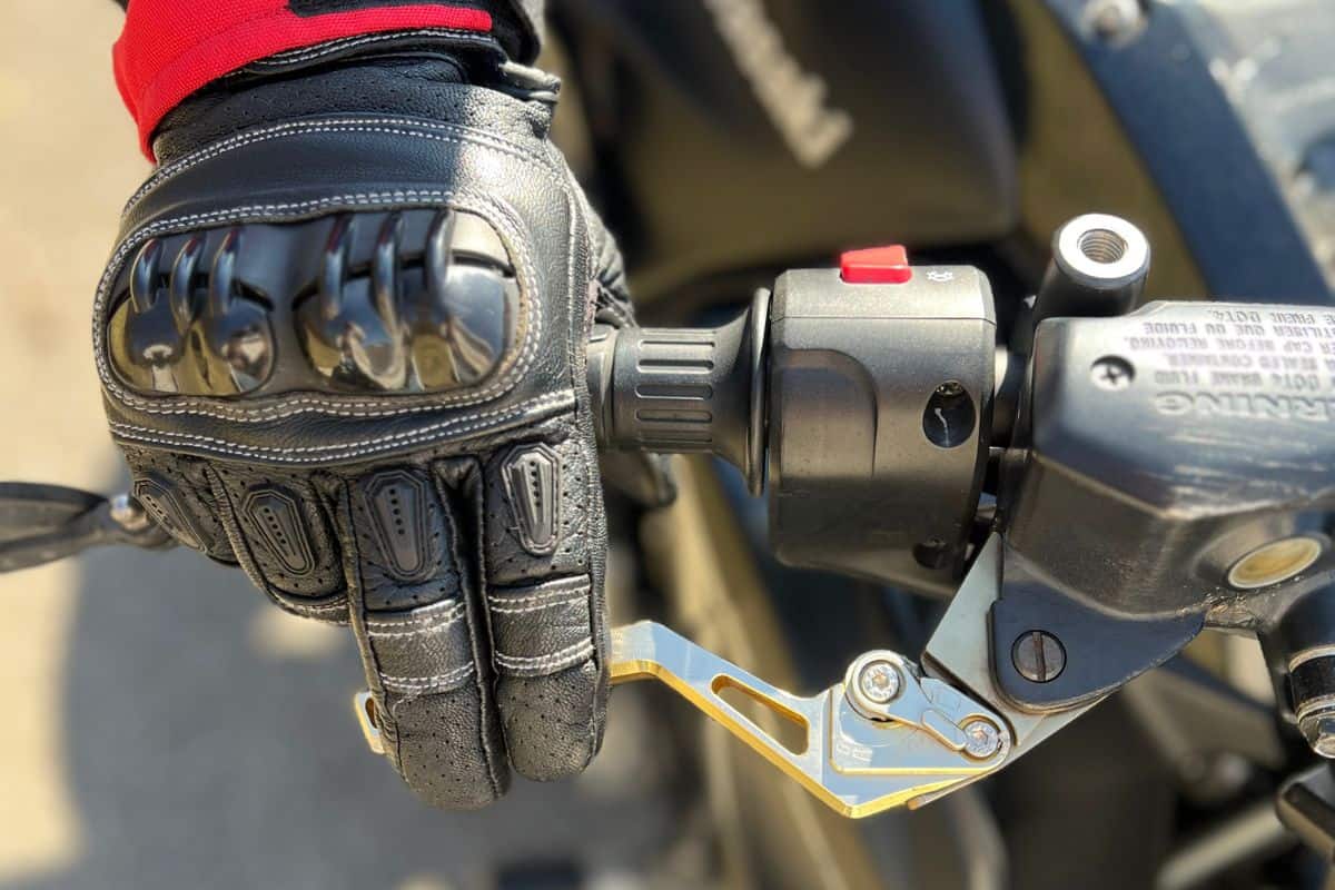 close up of rider with fingers on front brake lever