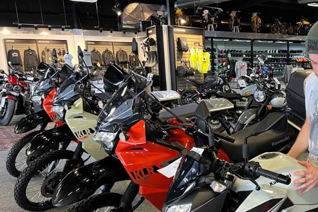 inside of dealership with motorcycles lined up