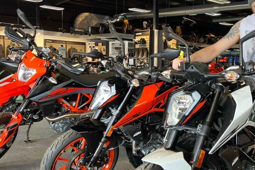 inside of motorcycle dealership with person trying bike just out of frame