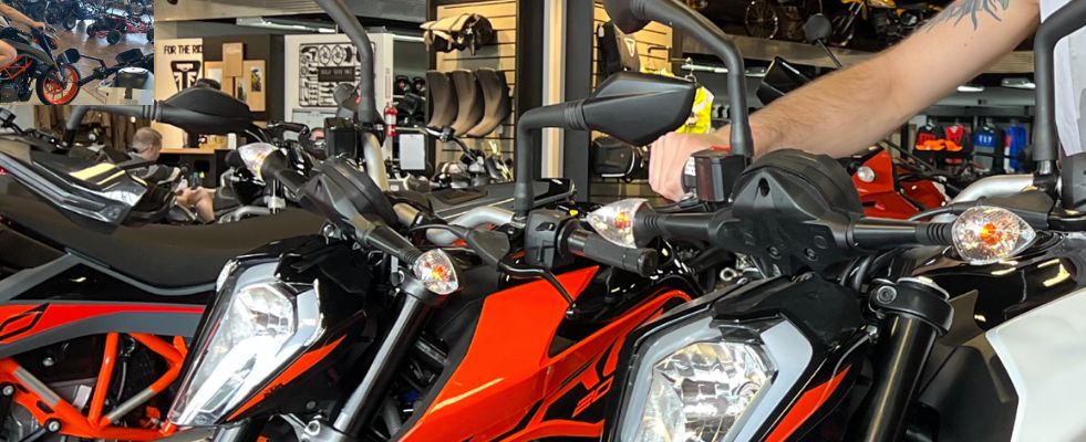 someone testing out a motorcycle in a dealership