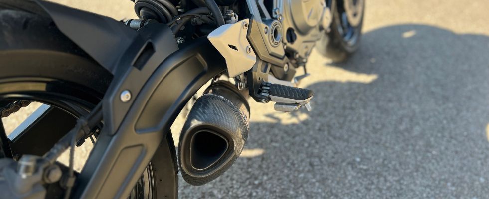 close up of scuffed motorcycle exhaust